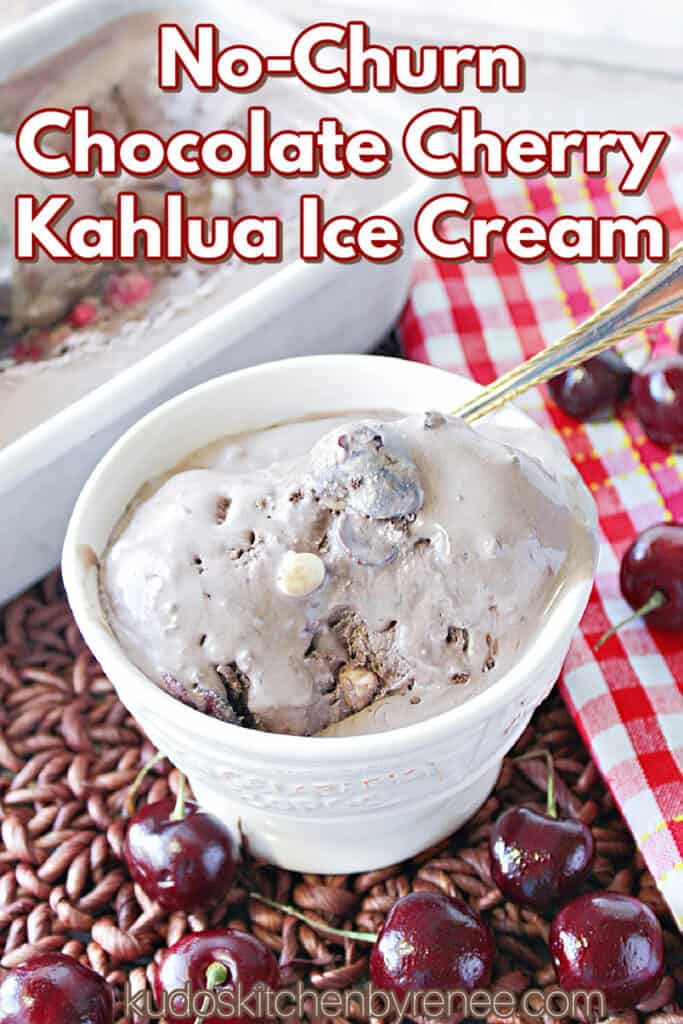 A vertical closeup image along with a title text overlay graphic for Chocolate Cherry Kahlua Ice Cream with a spoon and fresh cherries on the table in front of the dish.