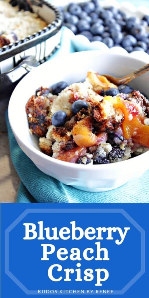 A vertical closeup along with a title text overlay graphic for Blueberry Peach Crisp with a spoon and a blue napkin.