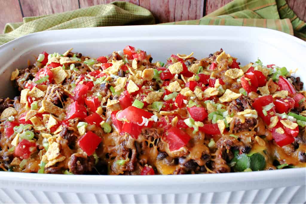 A white casserole dish filled with colorful Taco Filled Zucchini Boats.