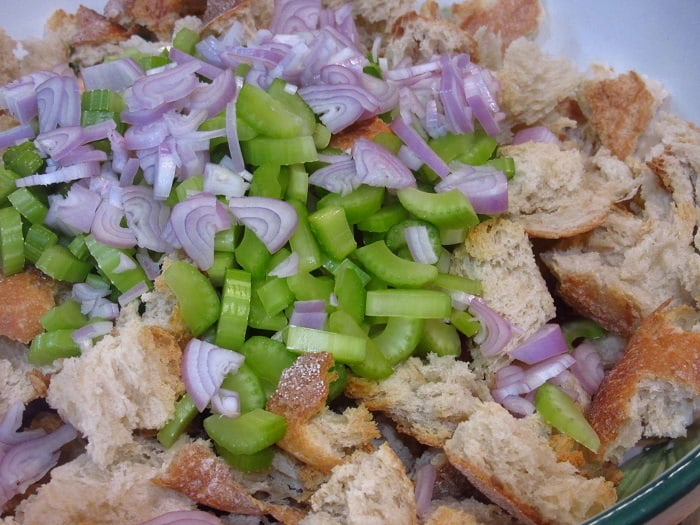 Onions Celery and Bread in a bowl.