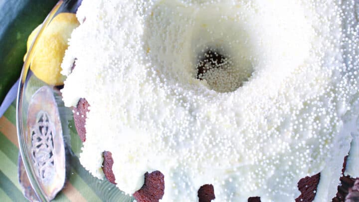 Ginger Lemon Buttercream Frosting on a bundt cake with white non pareils
