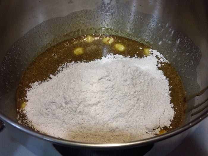 Flour in a bowl with wet ingredients.