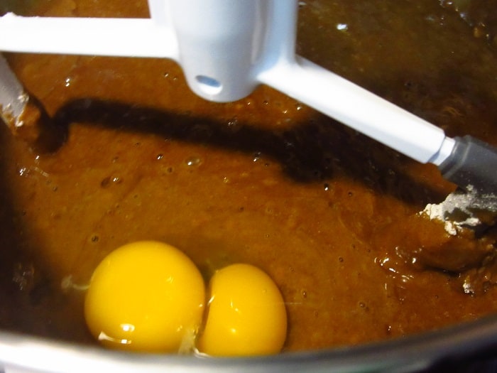 Eggs in a gingerbread cake batter.