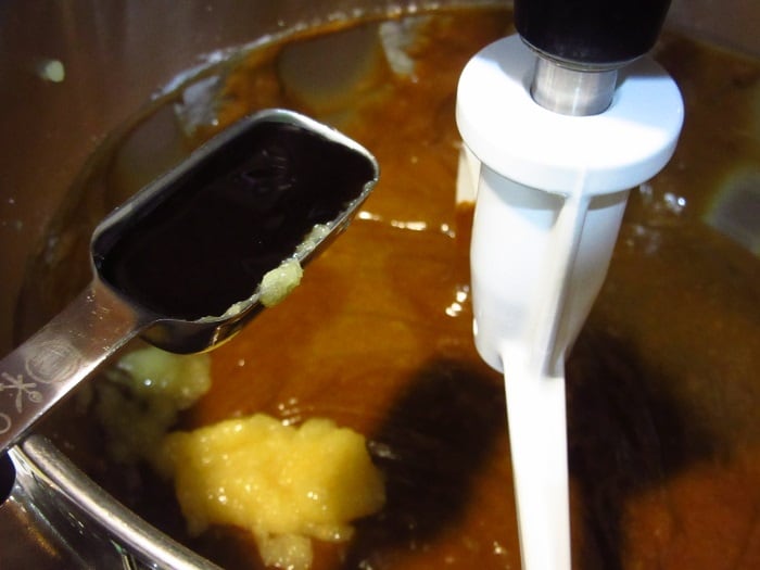 Vanilla being added to a cake batter.