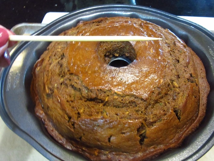A clean toothpick showing that a cake is fully baked.