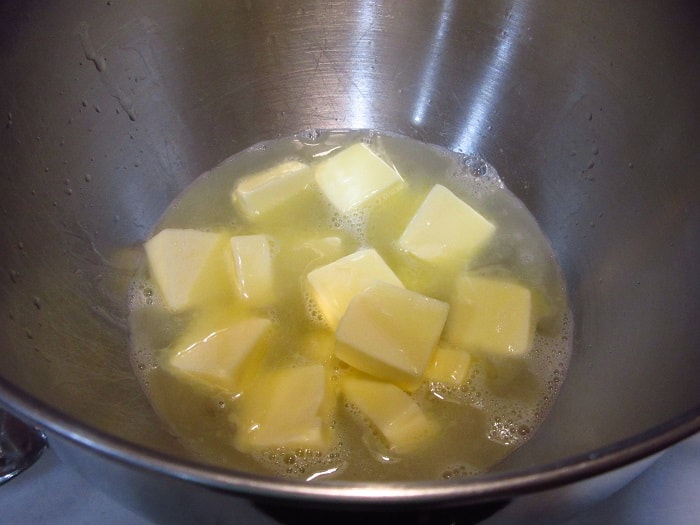 Butter melting in a bowl of water.