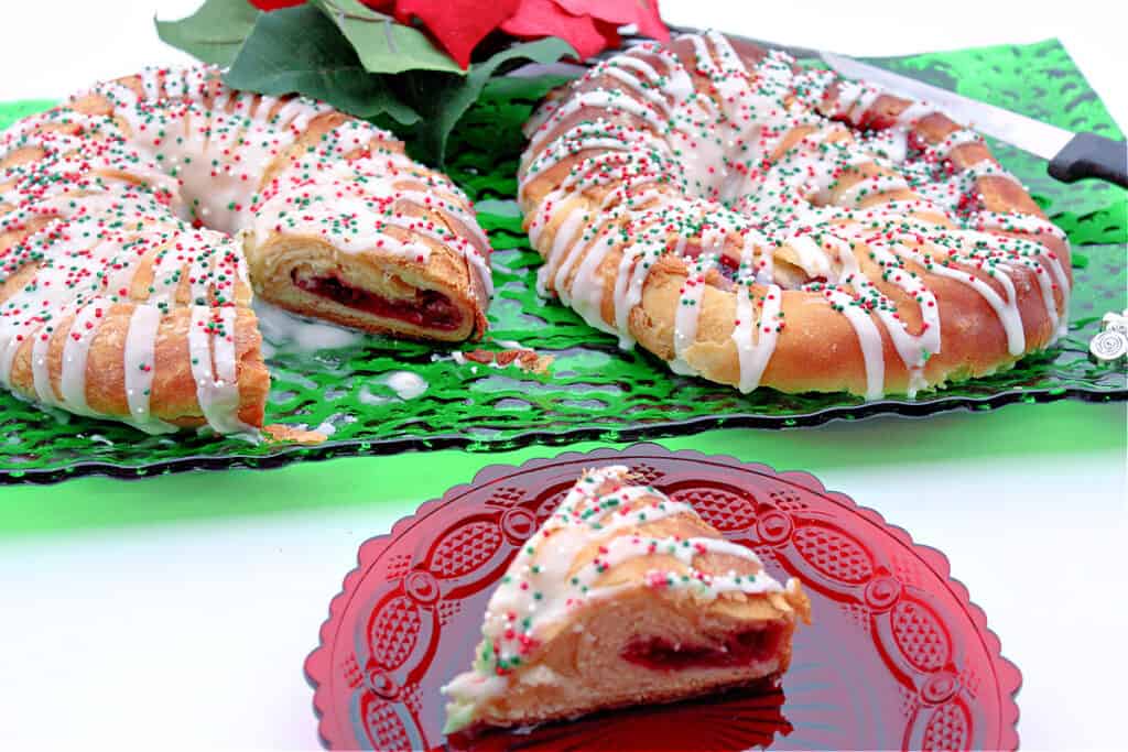 Two Cranberry Kringle in the background on a green glass plate and in the foreground is a slice of Cranberry Kringle on a red glass plate.