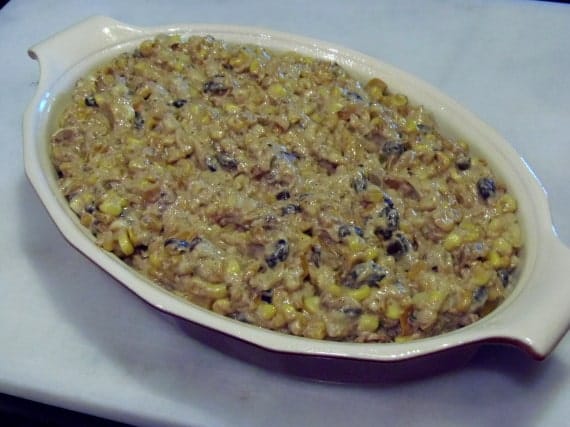 A corn and bean dip in a casserole dish.