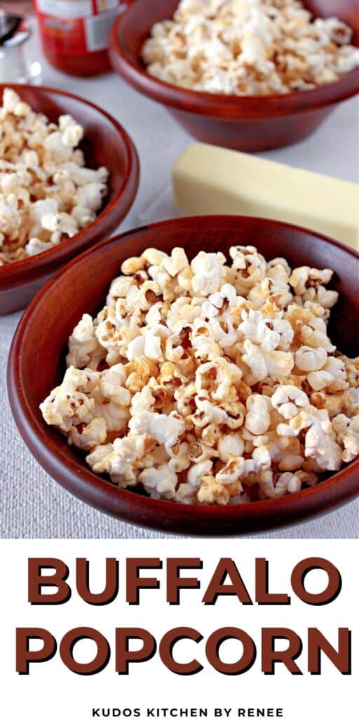 A vertical closeup along with a title text for Buffalo Popcorn with hot sauce, butter, and blue cheese over the top.