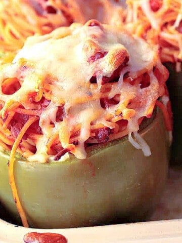 A Spaghetti Stuffed Bell Pepper topped with melted cheese.