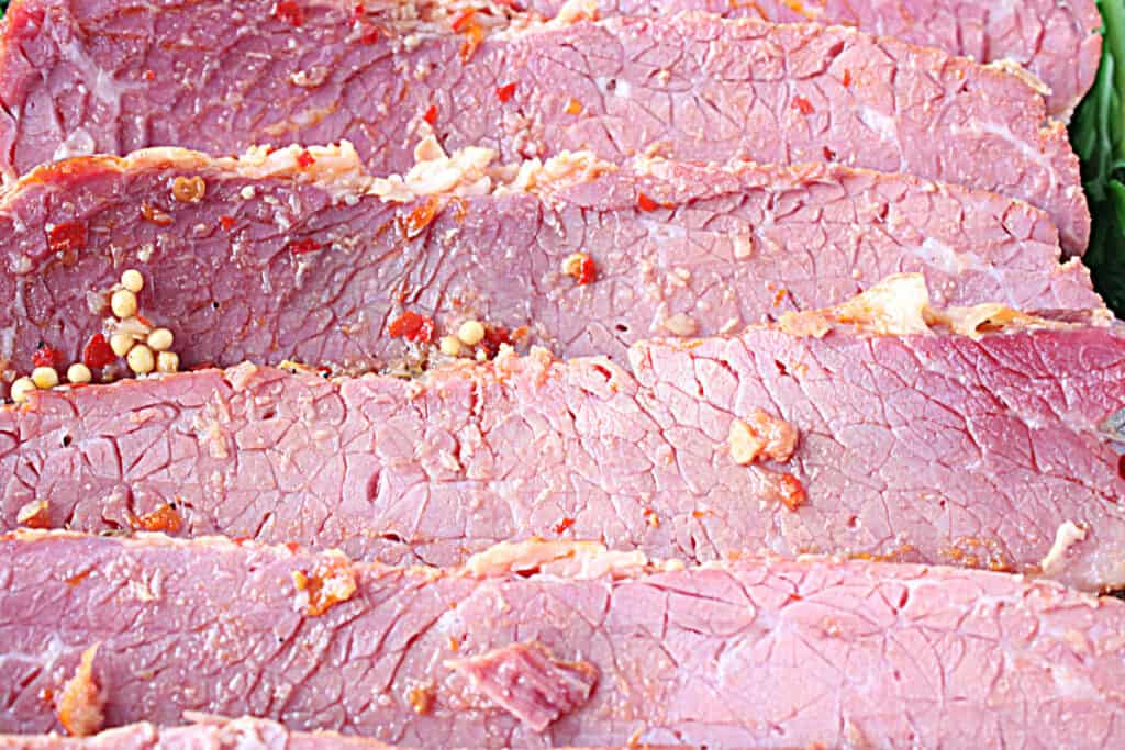 An extreme closeup photo of slices of tender Slow Cooker Corned Beef.