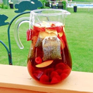 An outside picture of a pitcher of Peach and Raspberry Sun Tea for Beverage Recipes