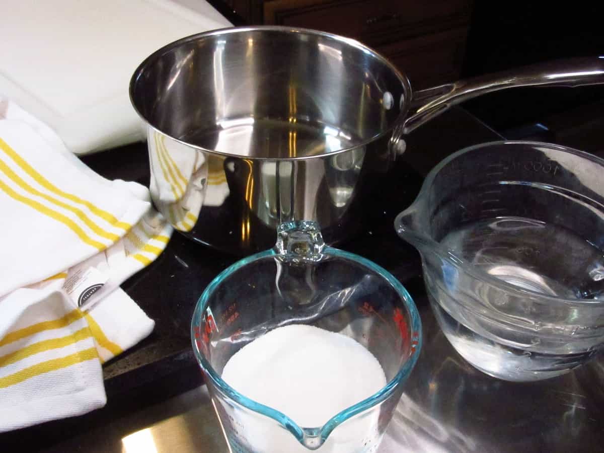 Sugar, water, and a saucepan for making a simple syrup for making homemade lemonade.
