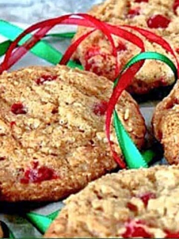 A bunch of Cinnamon Oatmeal Cookies surrounded with red and green ribbon.