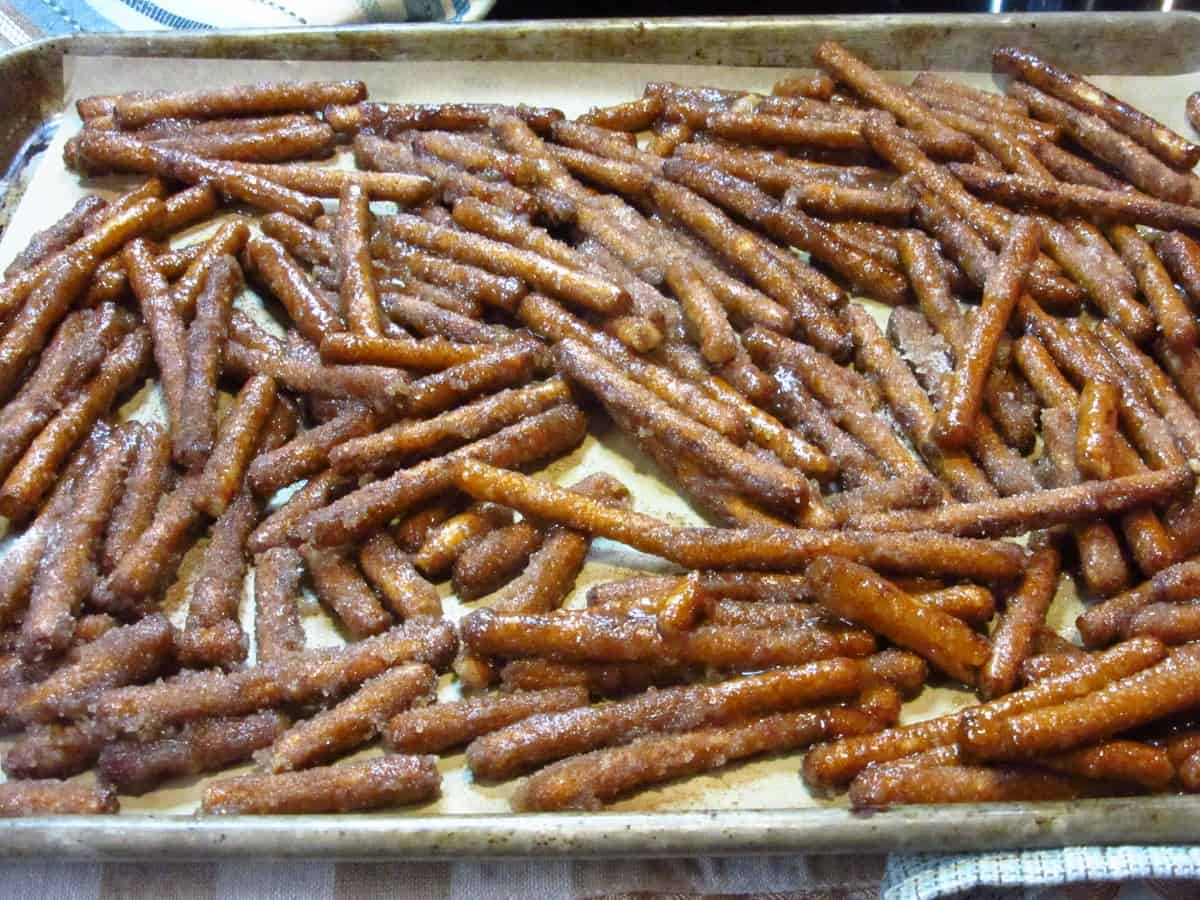 Cinnamon Sugar Pretzel Sticks layered on a baking sheet ready for the oven.