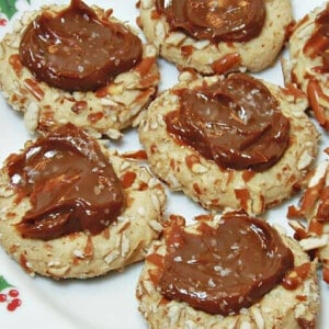 Closeup photo of several Caramel Pretzel Thumbprint Cookies on a plate.