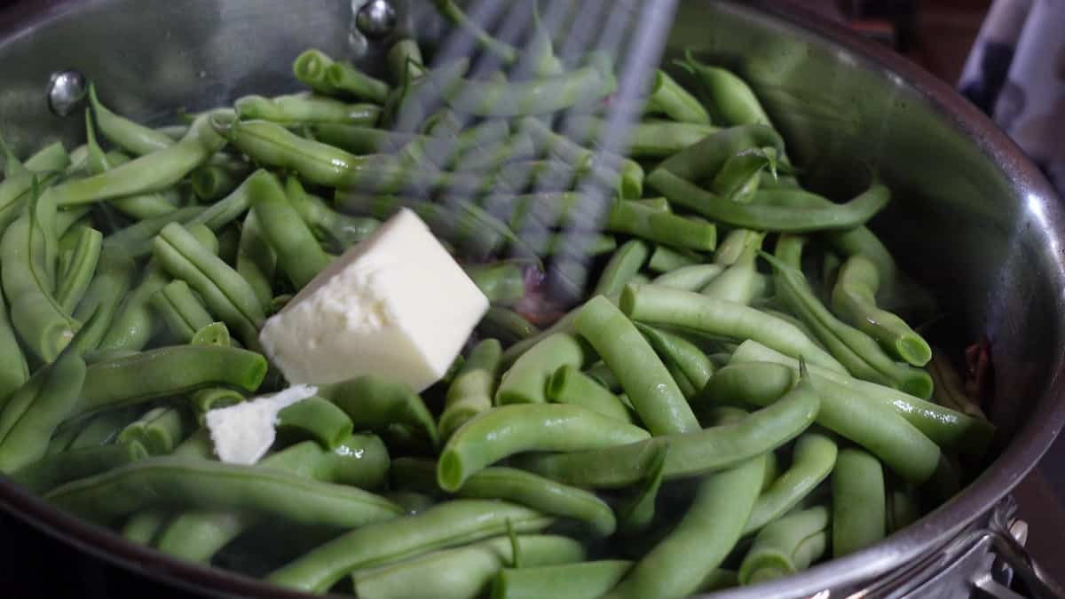 Green beans and butter in a skillet.