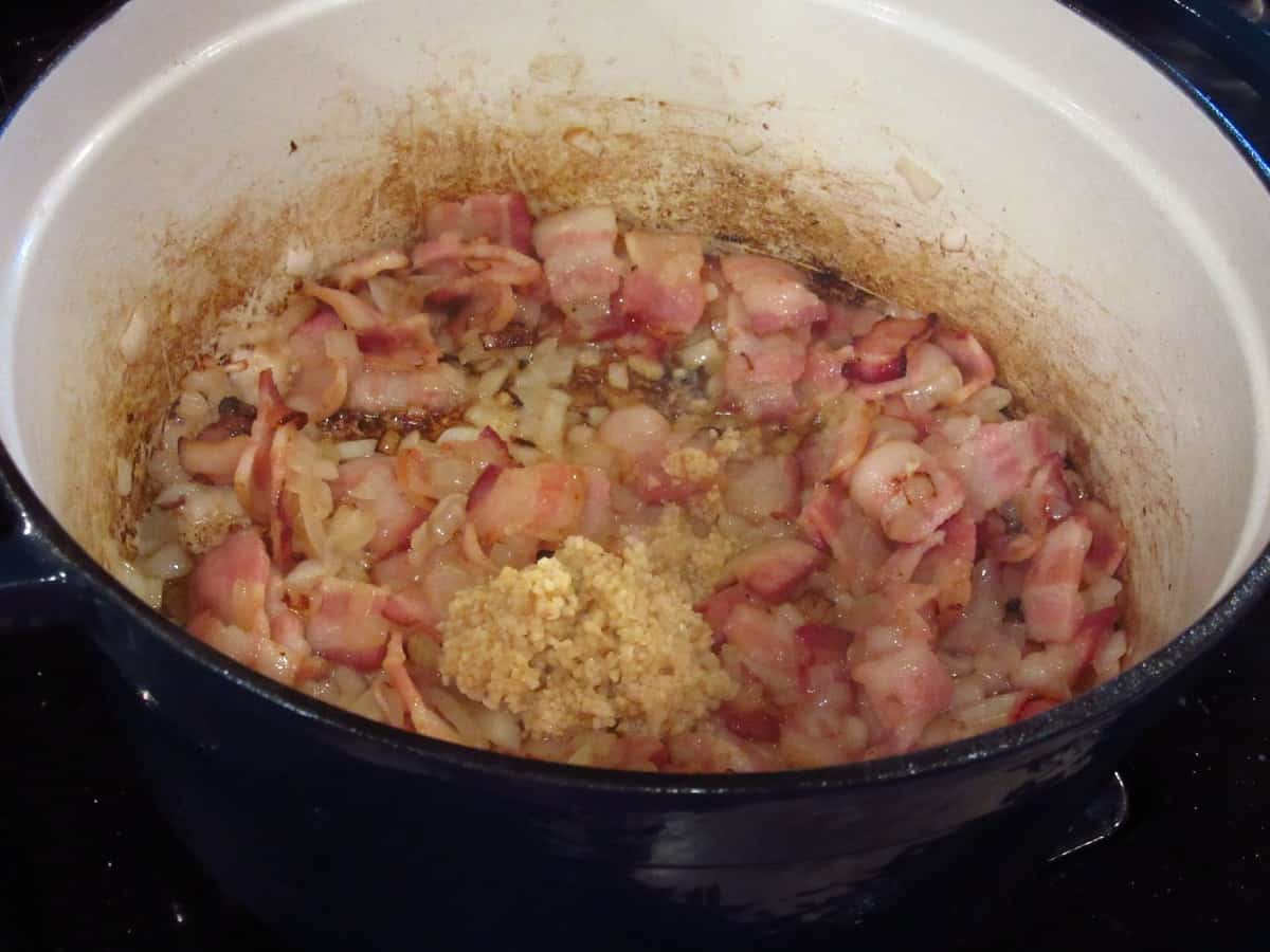 Bacon, onions, and minced garlic in a large Dutch oven.