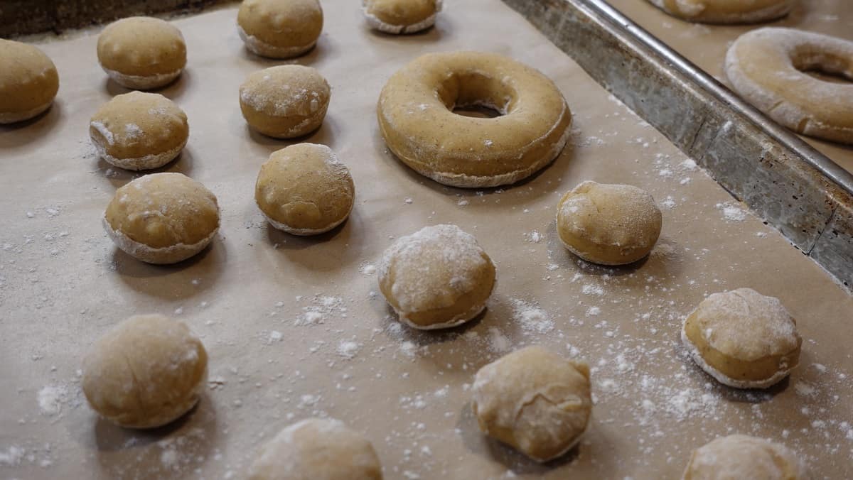 Yeast doughnut dough that has risen and is ready for frying.