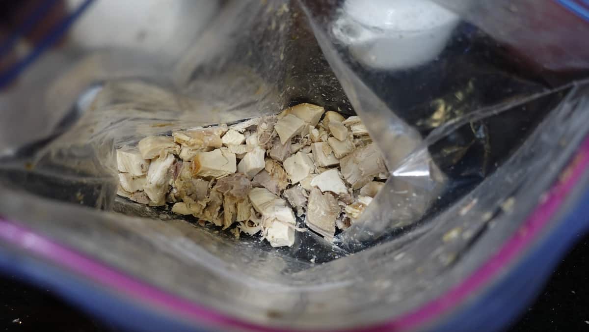 A look inside a zip top bag filled with leftover turkey pieces.