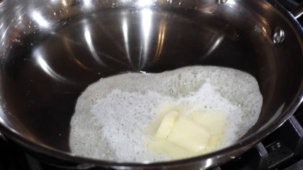 Butter melting in a skillet.