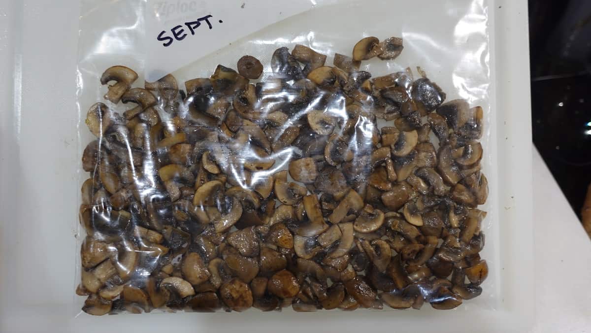 A plastic bag filled with Sauteed Mushrooms for freezing