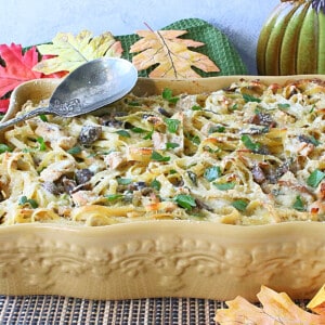 A casserole dish filled with leftover turkey and linguine.