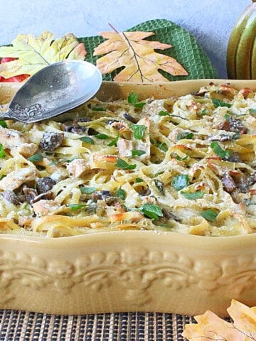 A casserole dish filled with leftover turkey and linguine.