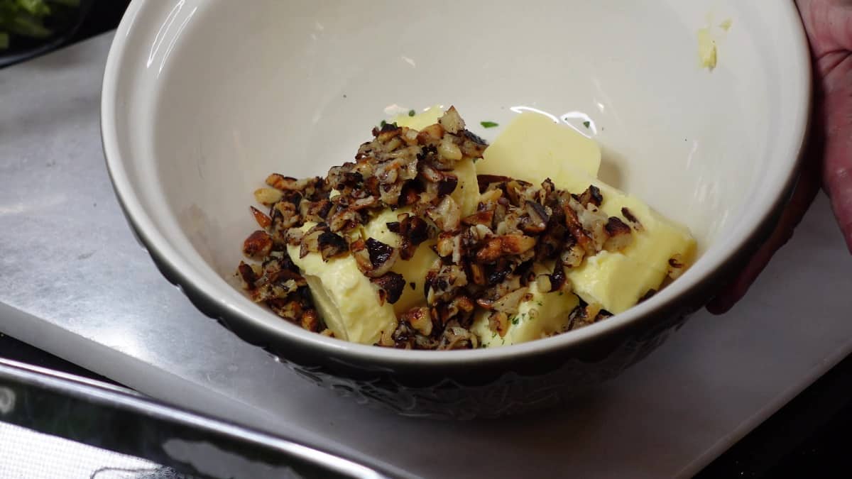 Butter and roasted garlic in a bowl.