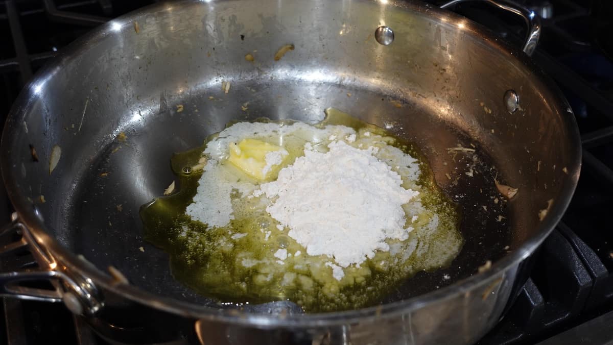 Making a roux with butter and flour.