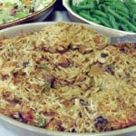 A casserole with orzo pasta, chicken, and mushrooms.