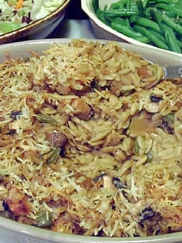 A casserole with orzo pasta, chicken, and mushrooms.