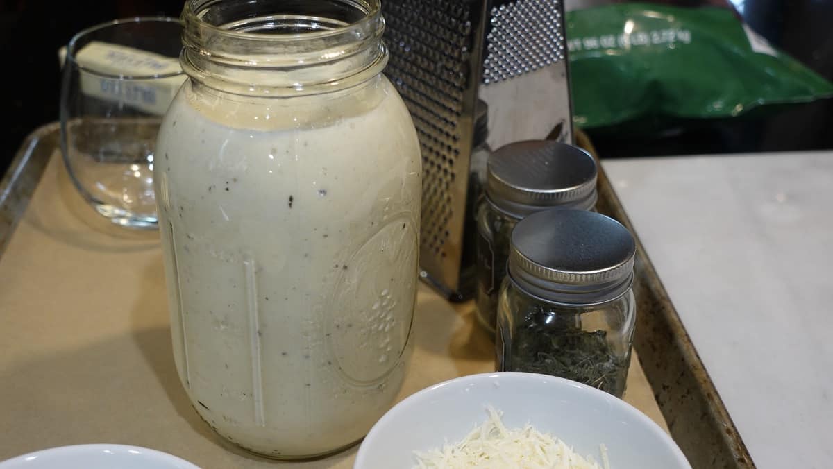 A completed jar of Homemade White Wine Alfredo sauce.