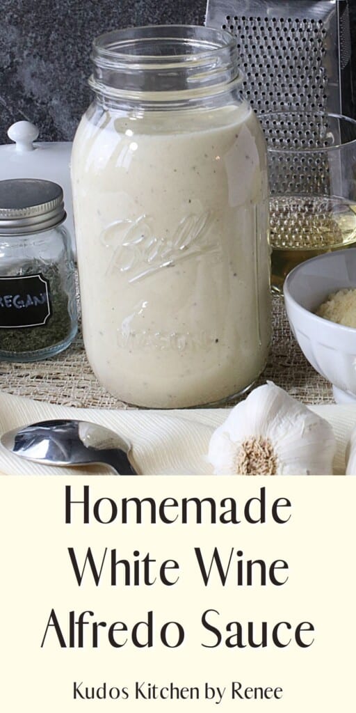 A glass jar filled with Homemade White Wine Alfredo Sauce.