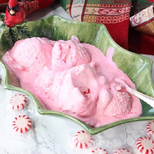 A serving of melting No-Churn Peppermint Schnapps Ice Cream in a green bowl.