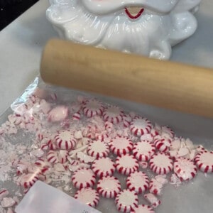 Peppermint candy being crushed by a rolling pin.