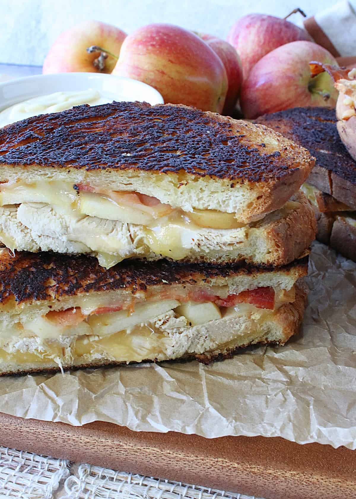 A Turkey and Smoked Gouda Grilled Cheese sandwich with bacon and apple.