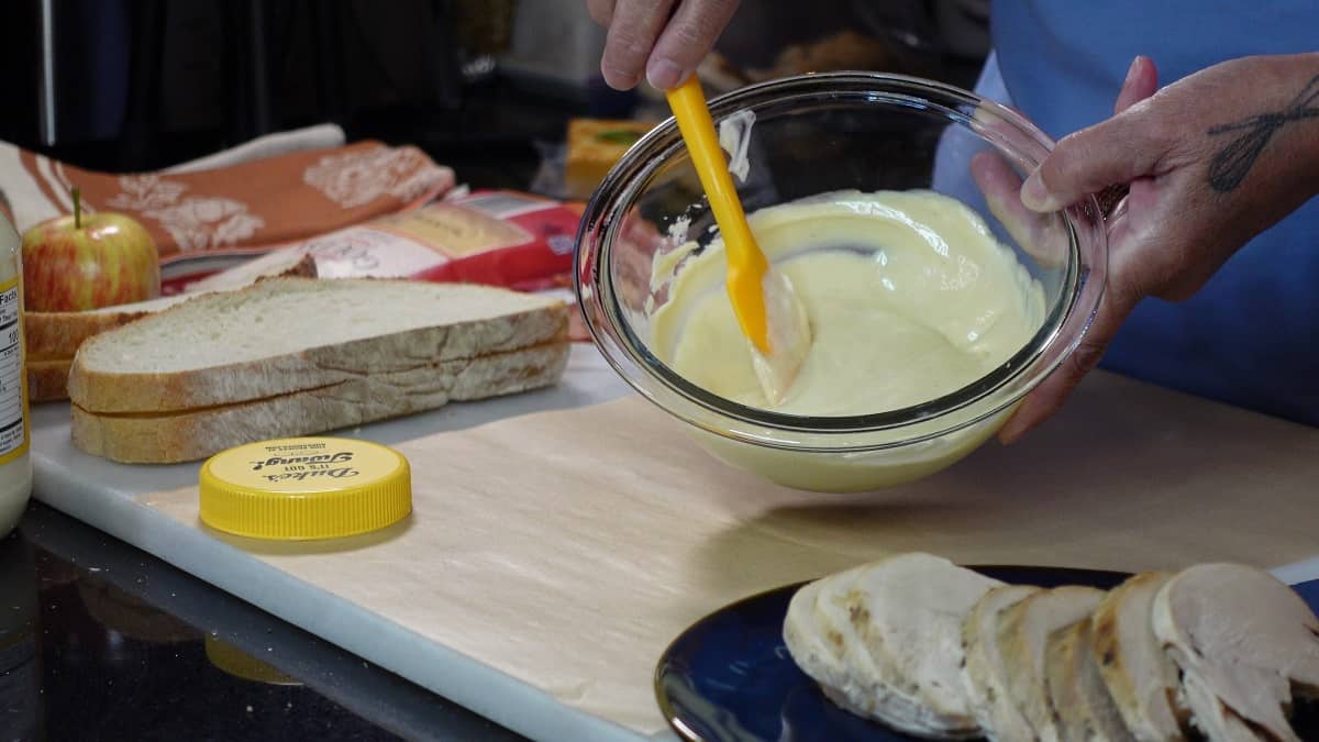 A glass bowl with honey mayo mustard dipping sauce.