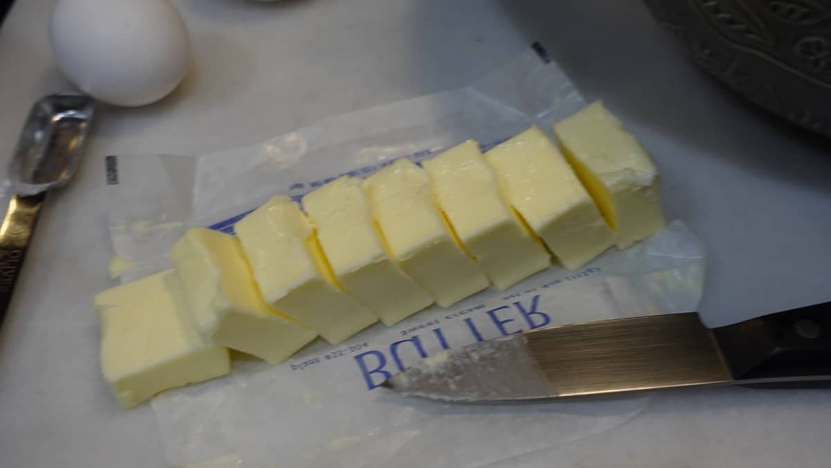 A stick of butter that has been cut into 8 tablespoons.