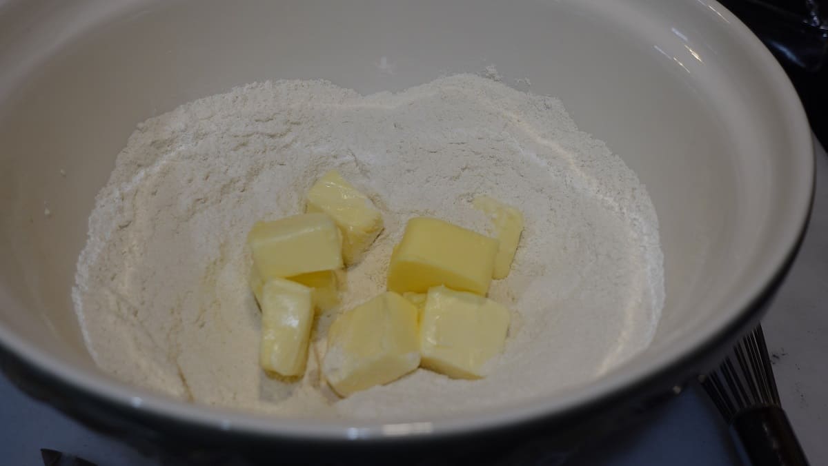 Cut up butter in a large bowl of flour.