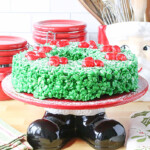 Cute Santa themed cake plate with a green rice krispies wreath on top.