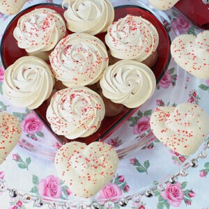 Almond Meringue Cookies on a glass plate.