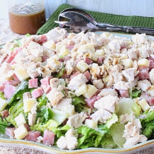 A Chicken Cordon Bleu Salad on a platter with cheese and meat.
