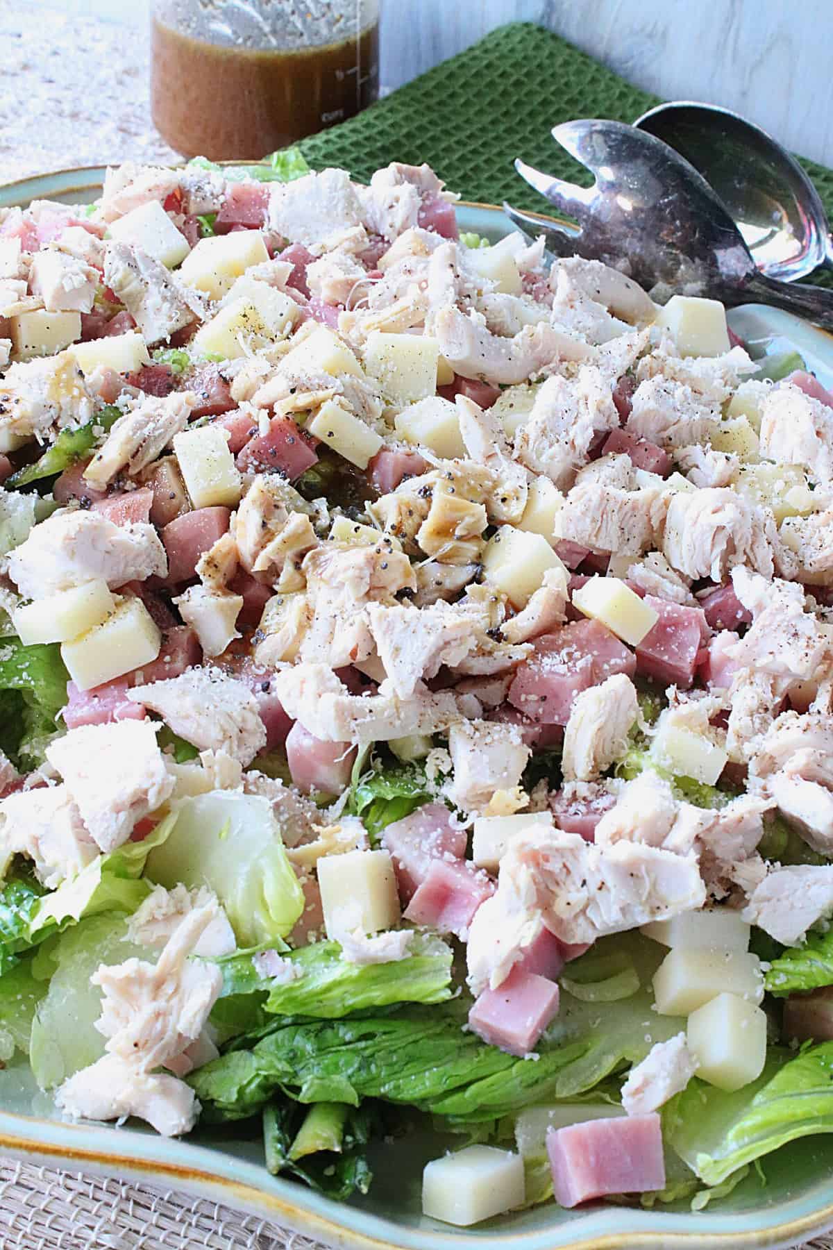 A delicious looking Chicken Cordon Bleu Salad with ham, chicken, and Swiss cheese.