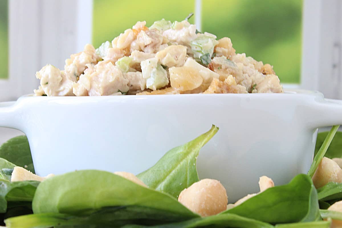 A white casserole dish filled with Hawaiian Chicken Salad at eye level.