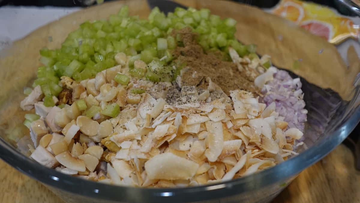Ingredients for Hawaiian Chicken Salad in a glass bowl.