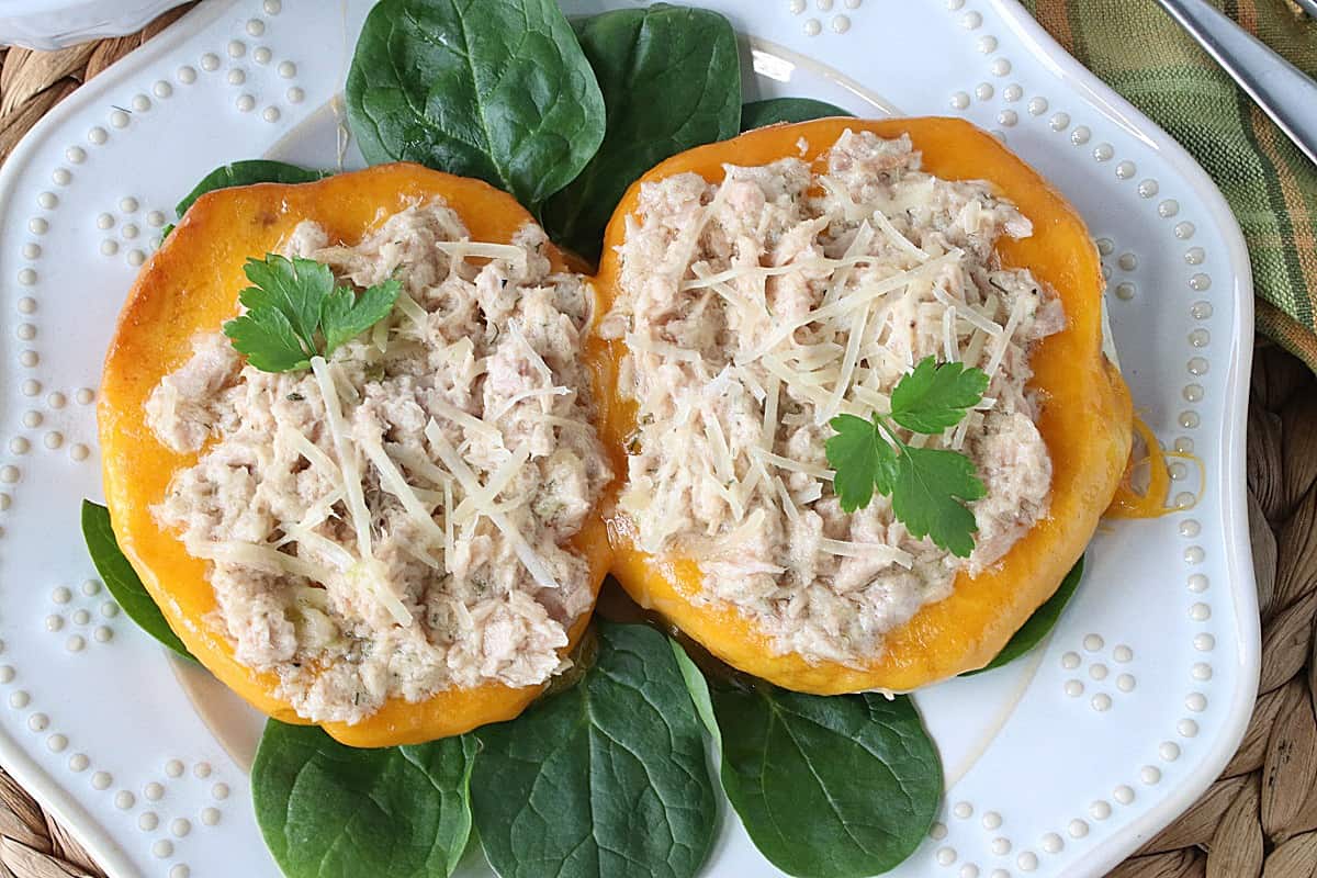 An overhead photo of two Cheddar Bagel Tuna Melt Sandwiches.