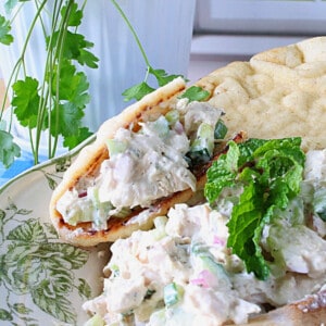 Tzatziki Chicken Salad with mint inside a pita bread.