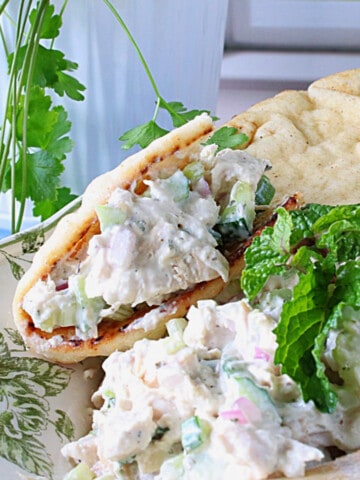 Tzatziki Chicken Salad with mint inside a pita bread.