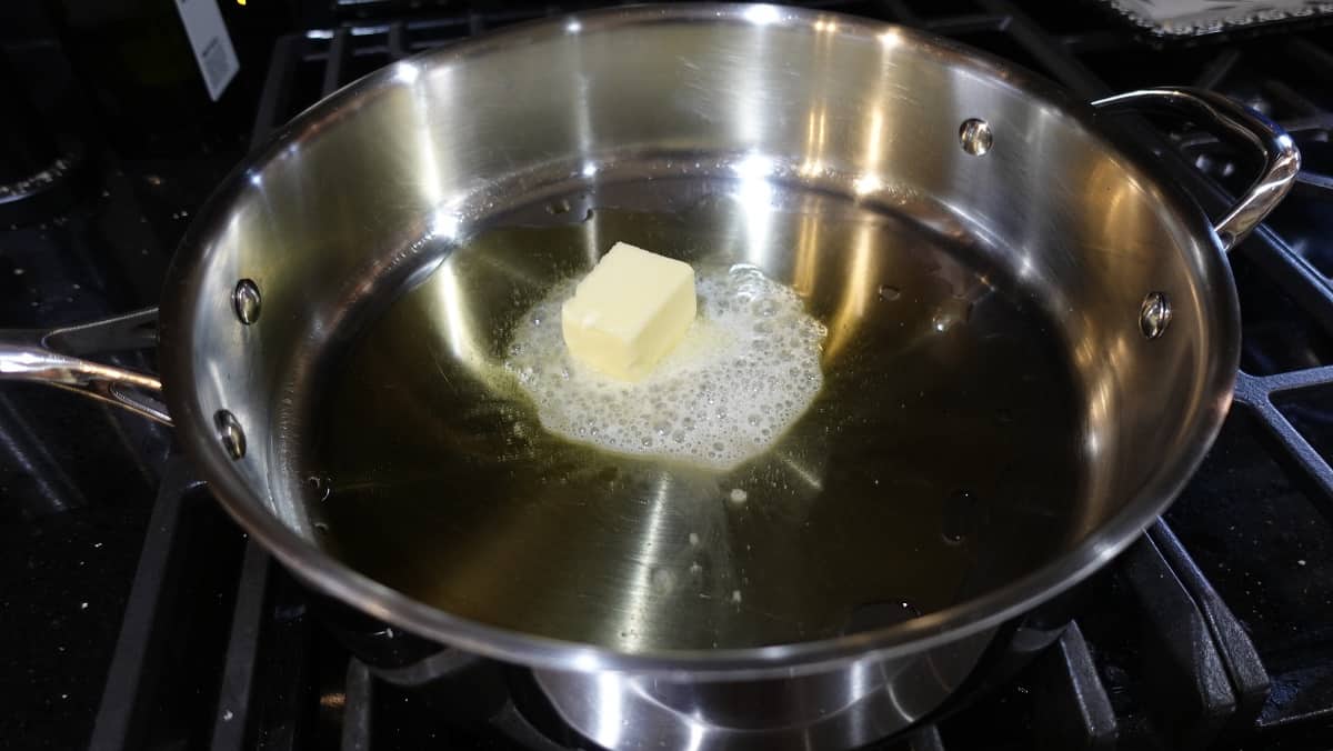 Melting butter in a skillet.